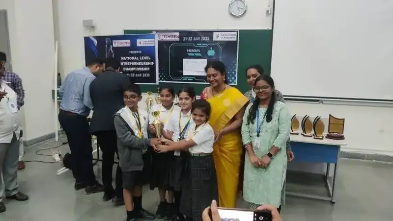 Junior robotics champions with trophy at IIT Hyderabad